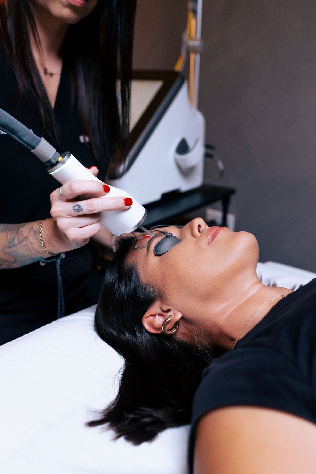 A 5 Birds cosmetic laser technician performing a treatment